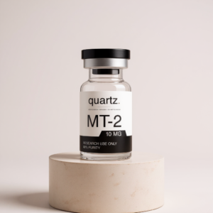 Melanotan II 10mg research vial on travertine pedestal – Quartz Peptides